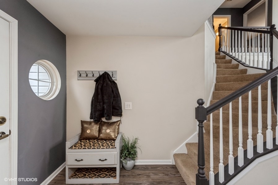 215 Rainier Way Fox Lake, IL 60020 - Photo 2 of 15 a view of a hallway with wooden floor