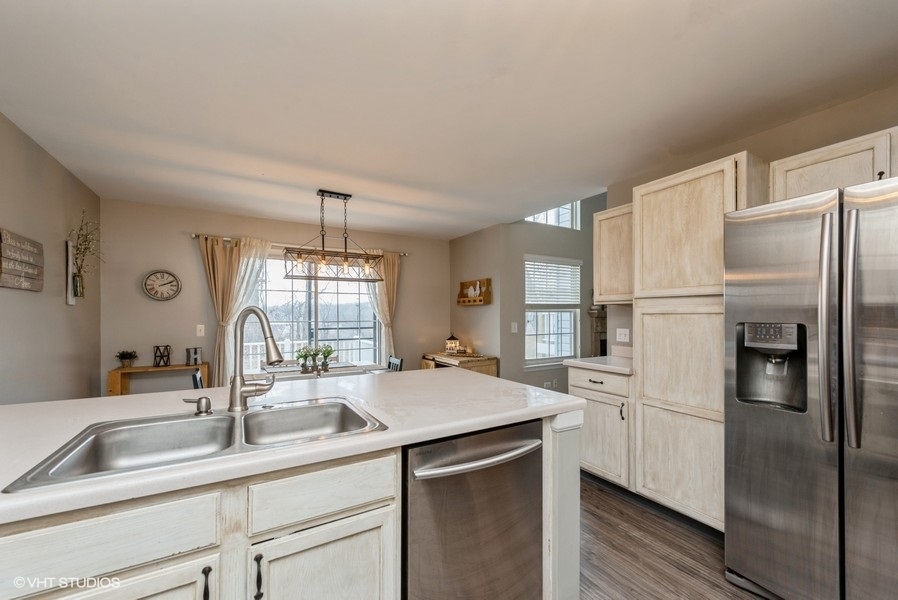 215 Rainier Way Fox Lake, IL 60020 - Photo 4 of 15 a kitchen with stainless steel appliances a sink stove and refrigerator