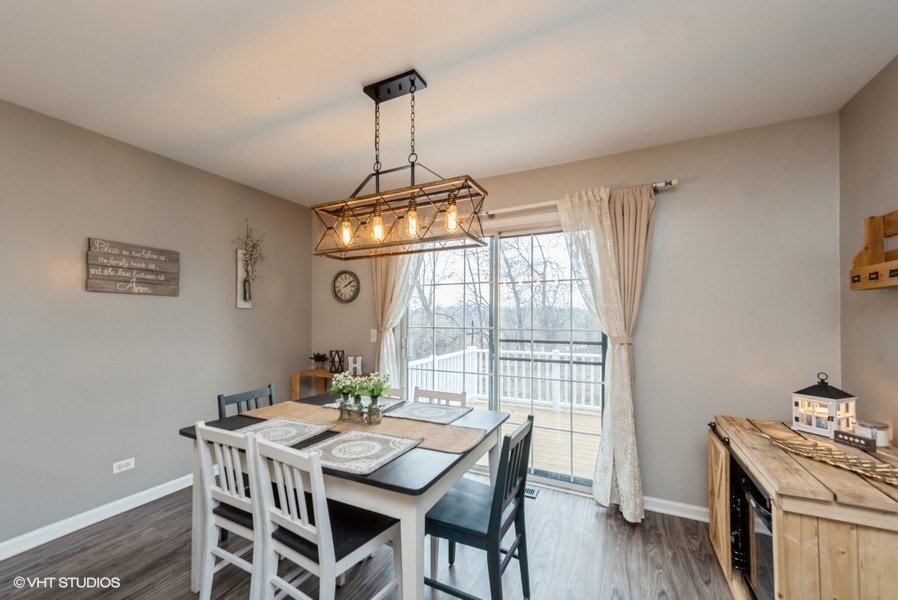 215 Rainier Way Fox Lake, IL 60020 - Photo 6 of 15 a view of a dining room with furniture window and wooden floor