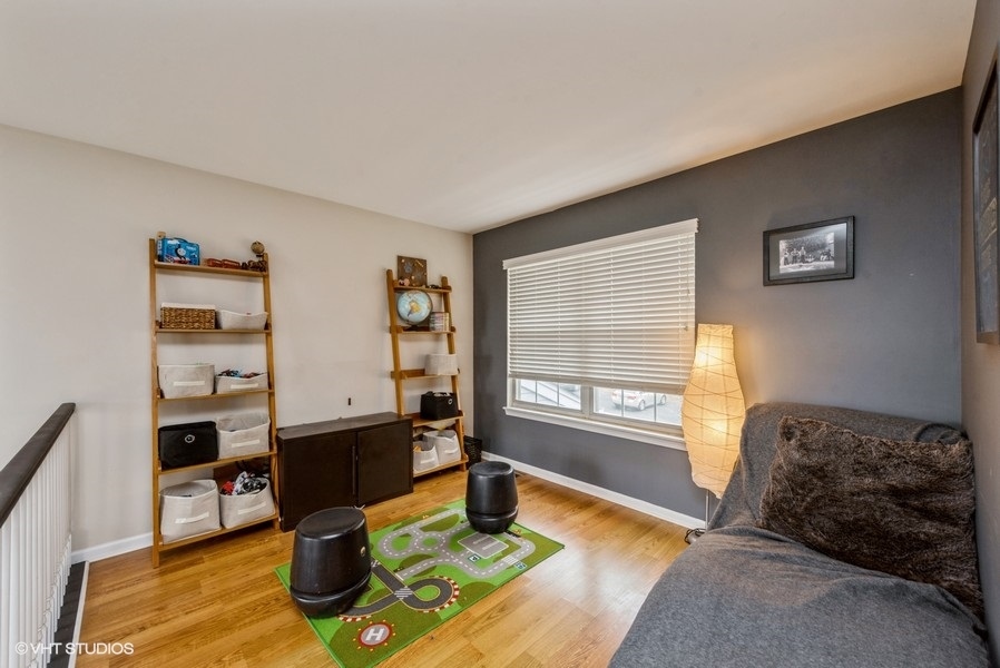 215 Rainier Way Fox Lake, IL 60020 - Photo 10 of 15 a living room with furniture and a window