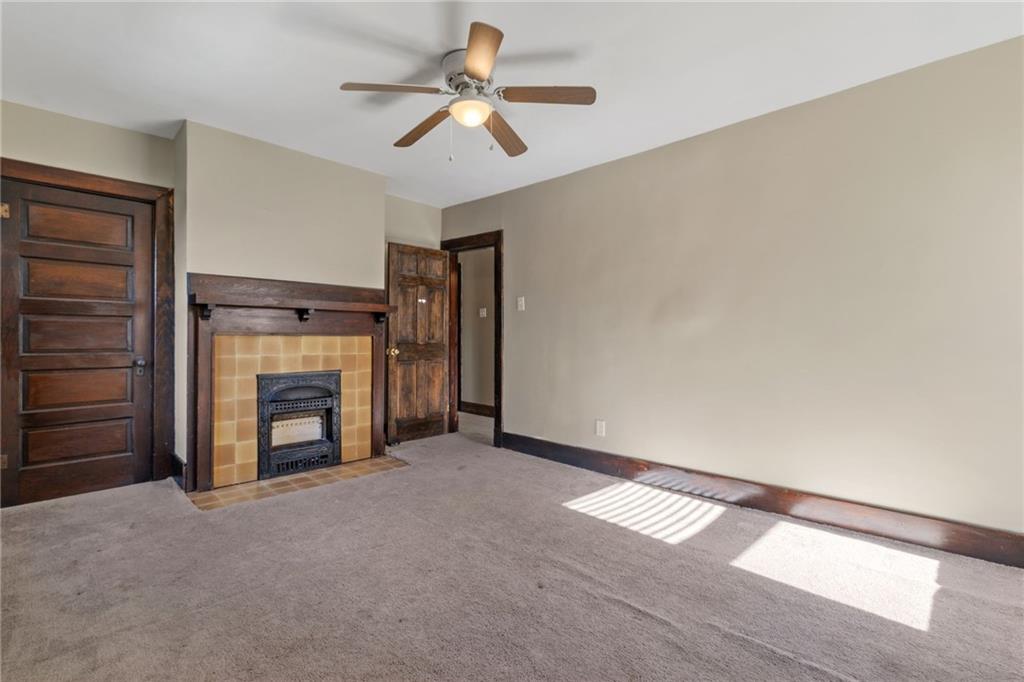 76 Warren Street Pittsburgh, PA 15205 - Photo 22 of 32 a view of an empty room with a fireplace
