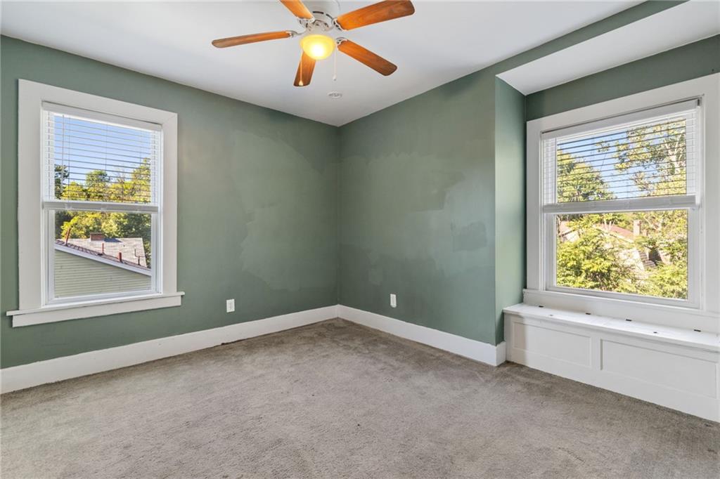 76 Warren Street Pittsburgh, PA 15205 - Photo 23 of 32 an empty room with windows and fan