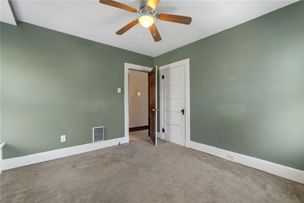 76 Warren Street Pittsburgh, PA 15205 - Photo 24 of 32 an empty room with chandelier fan