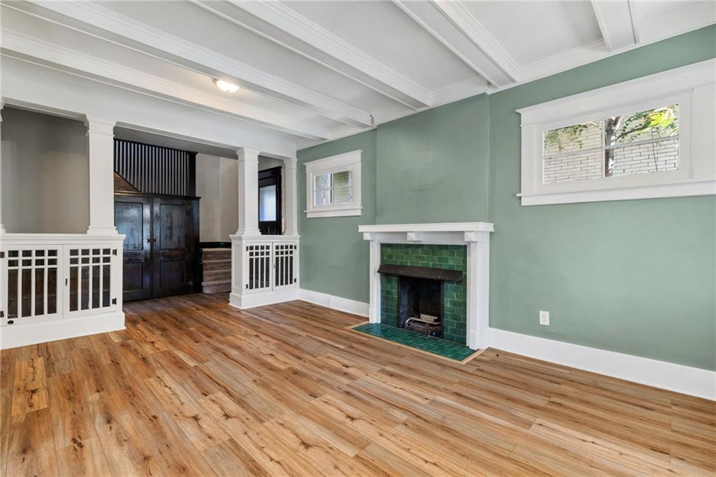76 Warren Street Pittsburgh, PA 15205 - Photo 5 of 32 a view of a livingroom with wooden floor and a fireplace