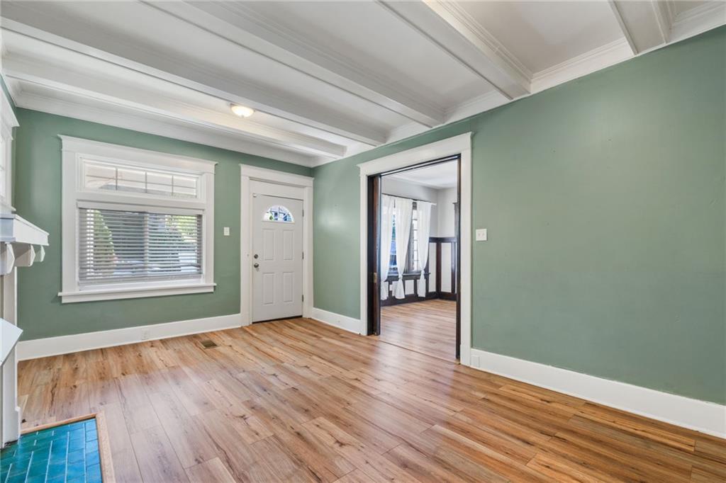 76 Warren Street Pittsburgh, PA 15205 - Photo 6 of 32 a view of an empty room with wooden floor and a window