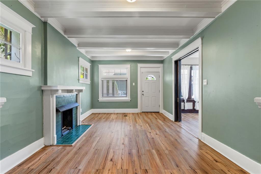 76 Warren Street Pittsburgh, PA 15205 - Photo 7 of 32 a view of a livingroom with wooden floor and a fireplace