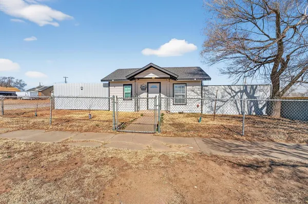 a view of a house with snow on the background