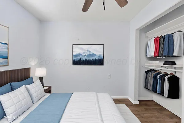 a bedroom with a bed and a couch