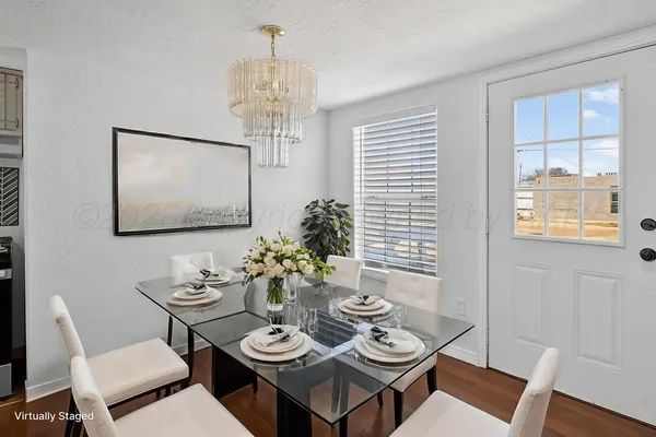 a view of a dining room with furniture window and wooden floor