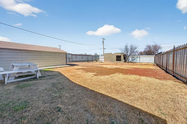a view of a kitchen with a sink and a fireplace
