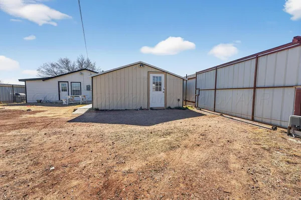 a view of a backyard of a house