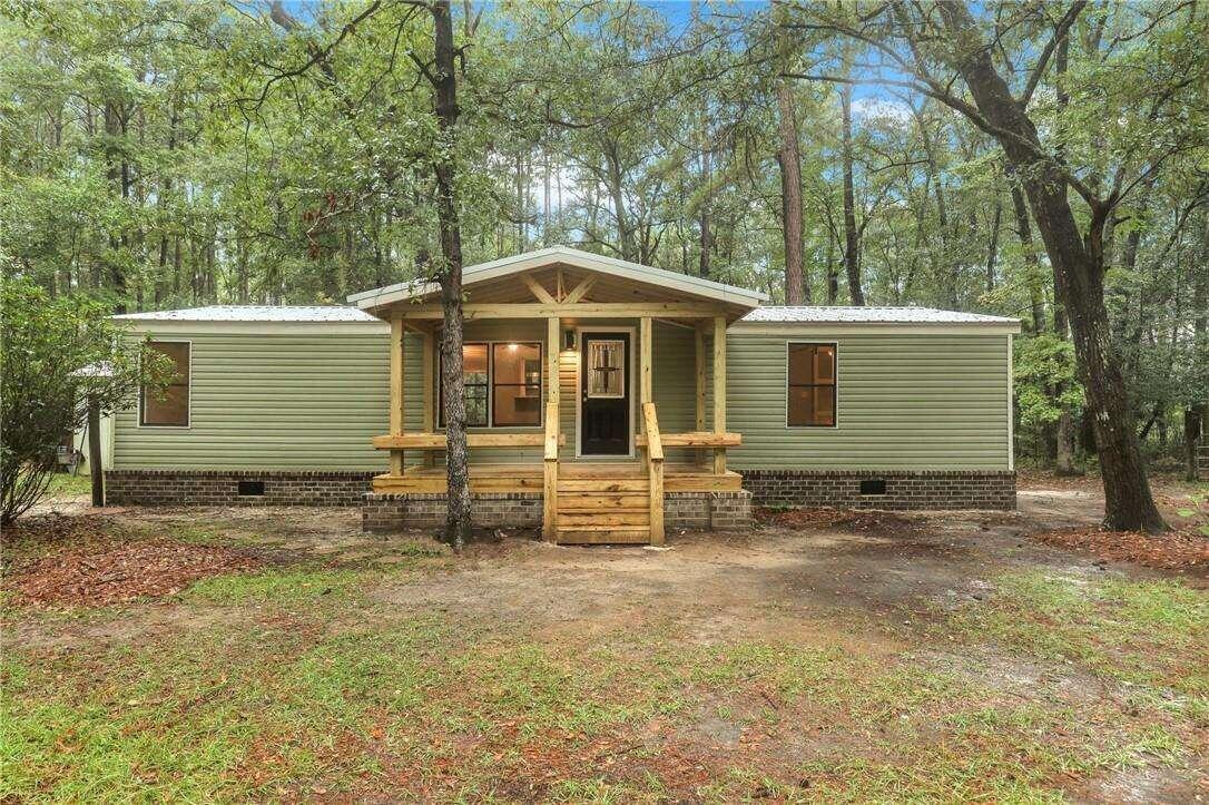 a front view of a house with yard