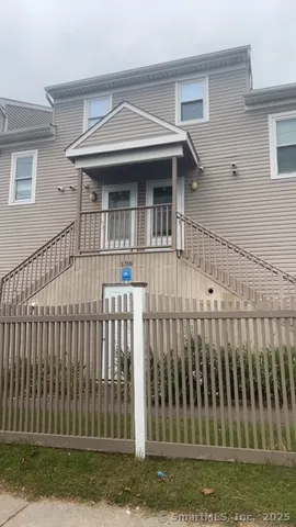a view of a house with a small yard