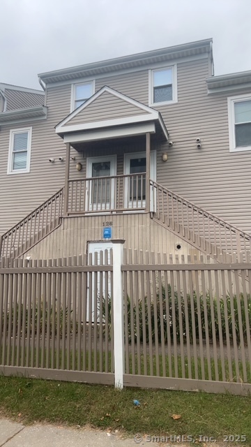 a view of a house with a small yard