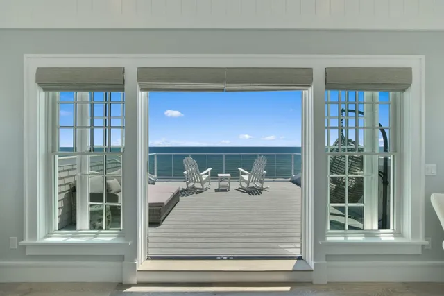 a living room with furniture and a bathroom