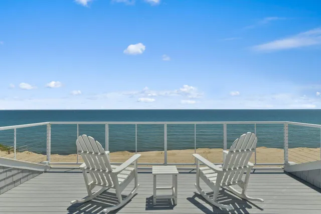 a kitchen with granite countertop a sink and a white cabinets