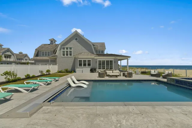 a front view of house with yard and outdoor seating
