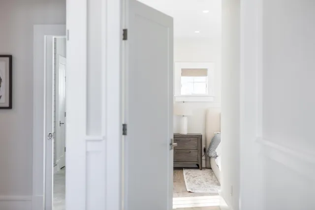 a bathroom with a double vanity sink toilet and tub