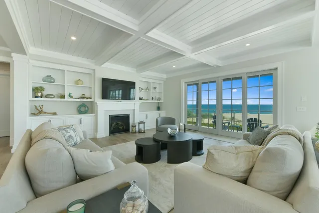 a living room with furniture fireplace and a flat screen tv