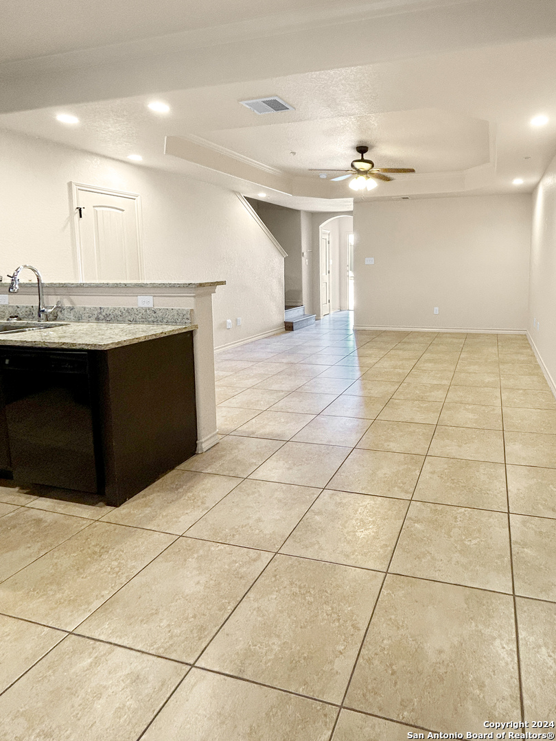 14006 Fratelli Road, Unit 103 San Antonio, TX 78233 - Photo 6 of 16 a view of a refrigerator and window in a room
