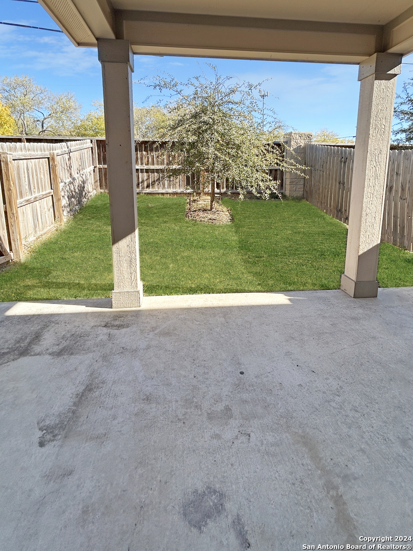 14006 Fratelli Road, Unit 103 San Antonio, TX 78233 - Photo 9 of 16 a view of a yard with porch