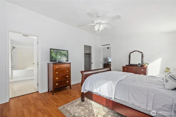 a bedroom with a bed and a dresser