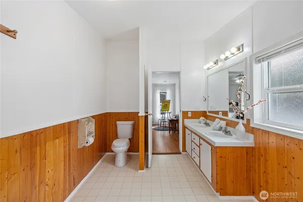 a bathroom with a sink a mirror and a bathtub