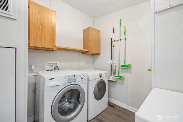 a utility room with dryer and washer