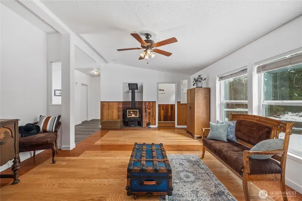 a living room with furniture and kitchen view