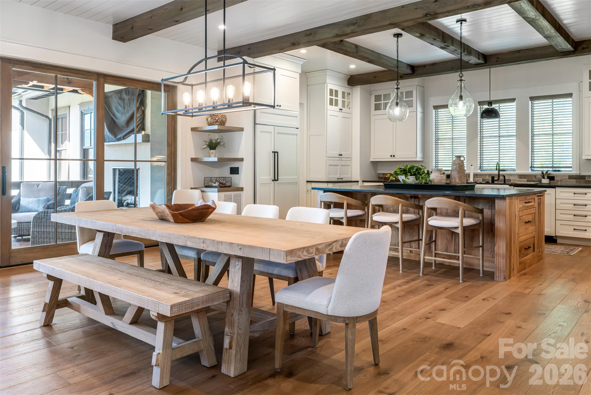 25 Rantis Lane Black Mountain, NC 28711 - Photo 11 of 48 a dining room with wooden floor a chandelier a wooden table and chairs