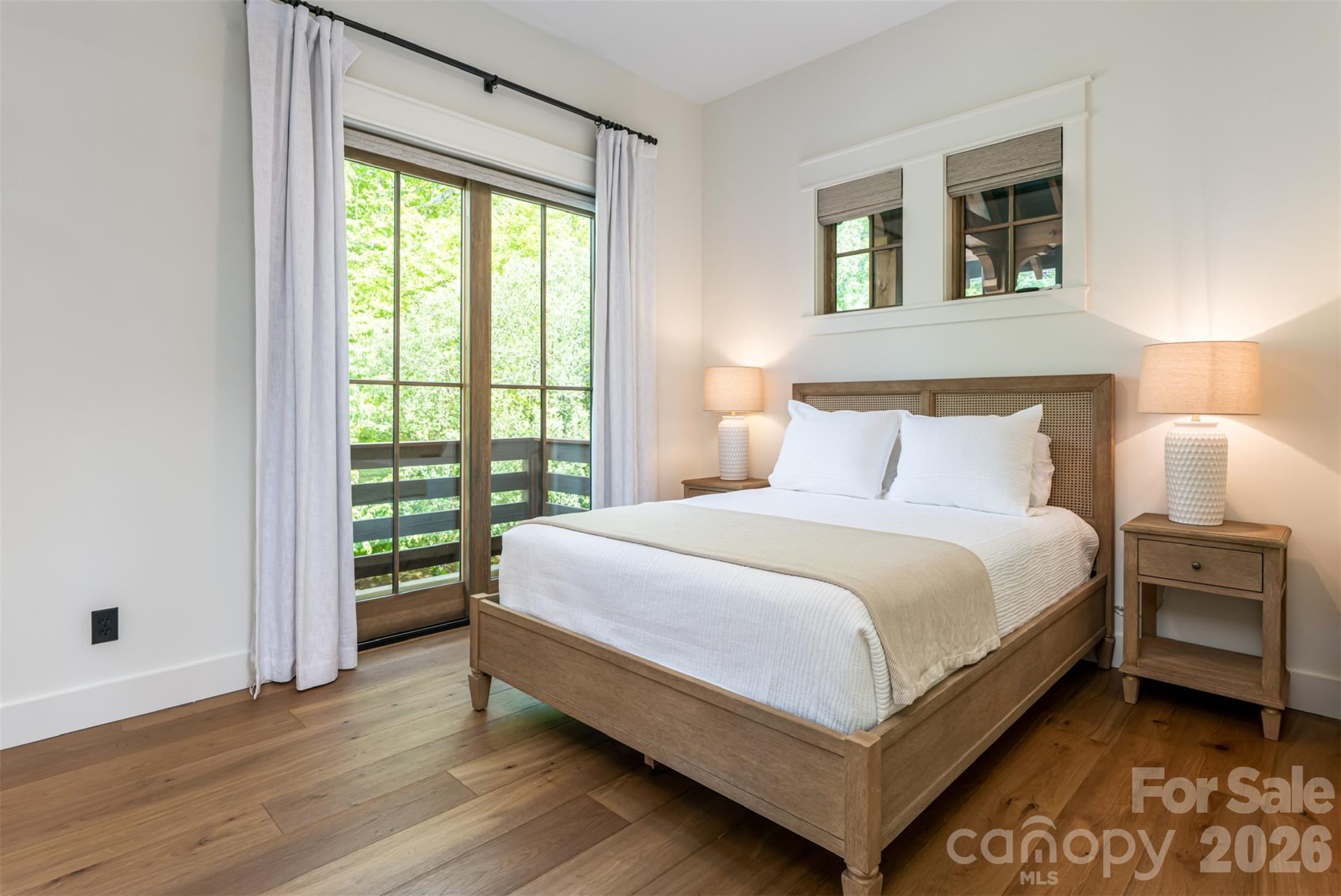 25 Rantis Lane Black Mountain, NC 28711 - Photo 23 of 48 a bed sitting in a bedroom next to a window