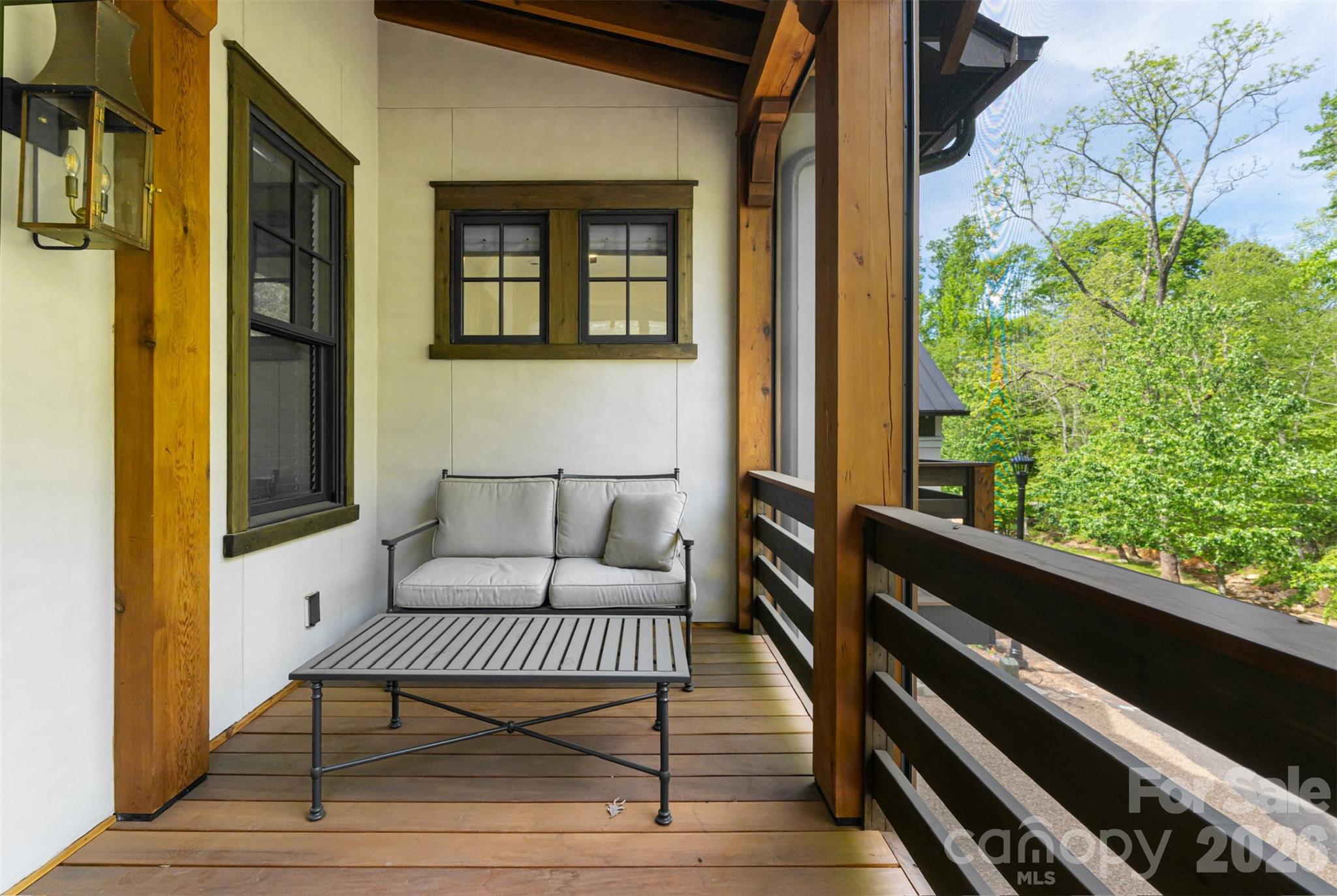 25 Rantis Lane Black Mountain, NC 28711 - Photo 25 of 48 a balcony with wooden floor and a potted plant