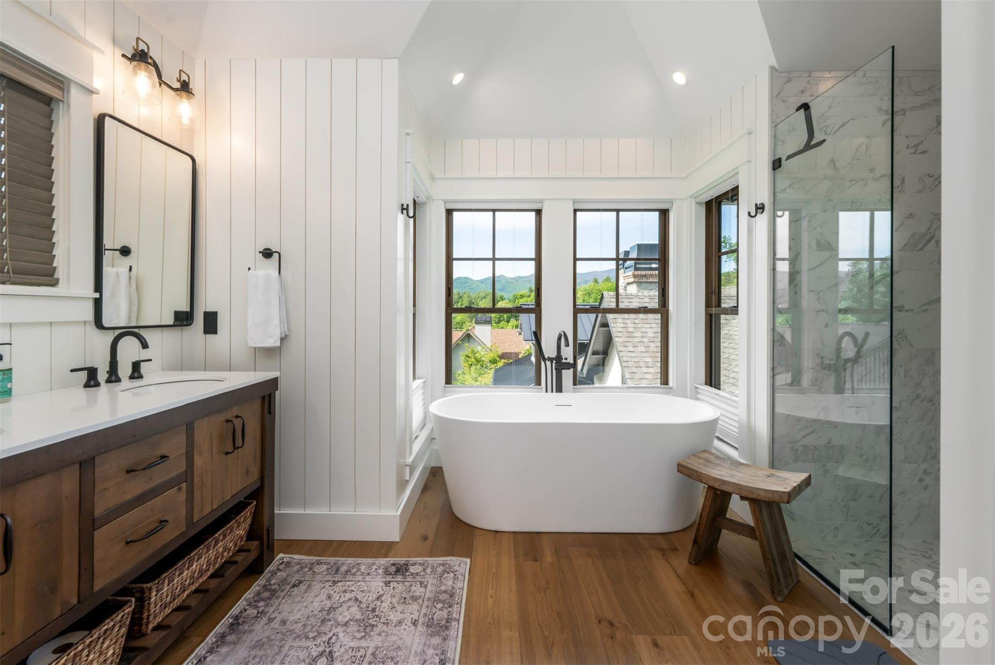 25 Rantis Lane Black Mountain, NC 28711 - Photo 36 of 48 a spacious bathroom with a tub sink and mirror