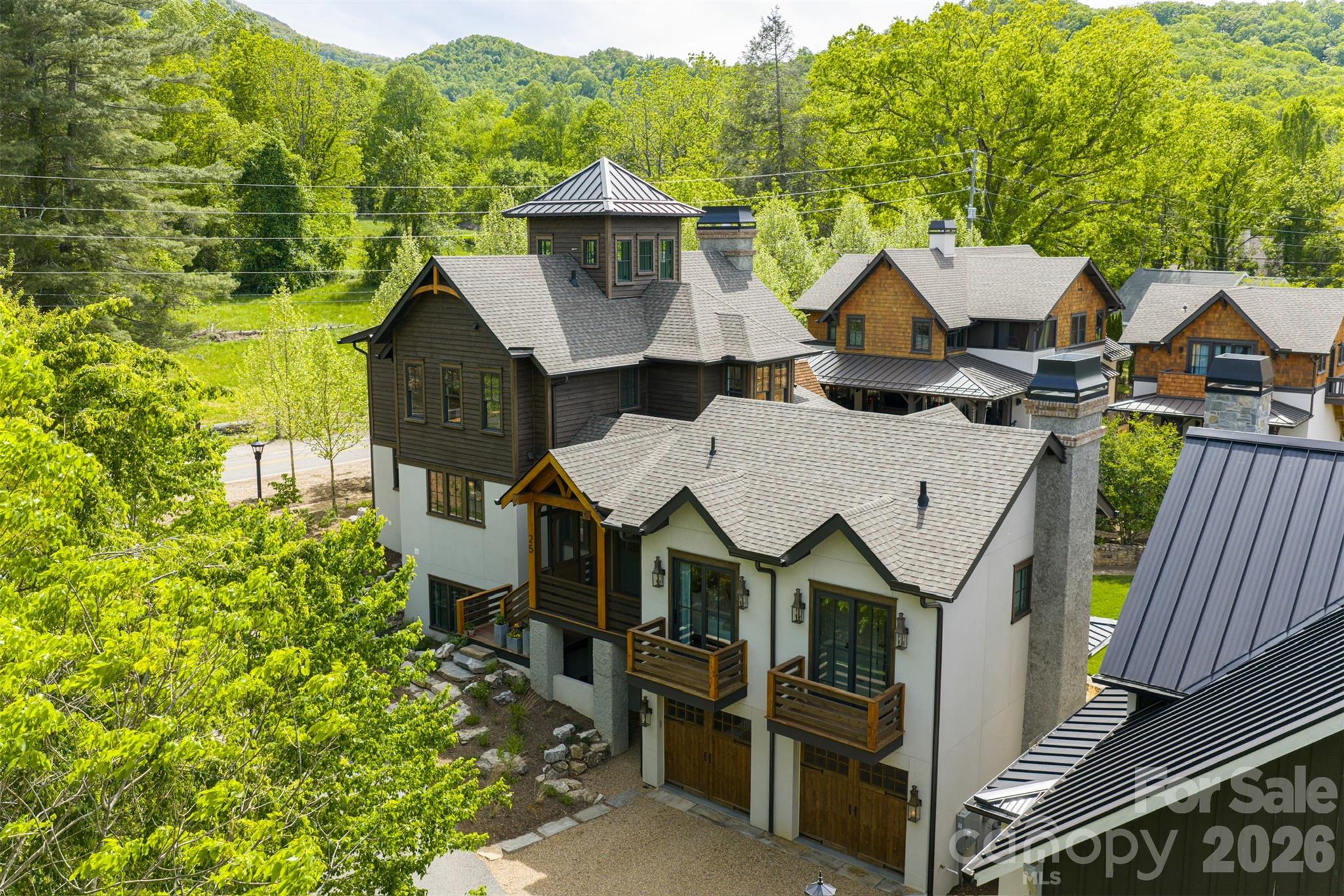25 Rantis Lane Black Mountain, NC 28711 - Photo 4 of 48 a view of a big house with wooden fence