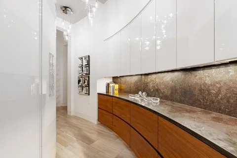 a kitchen that has a sink and a stove