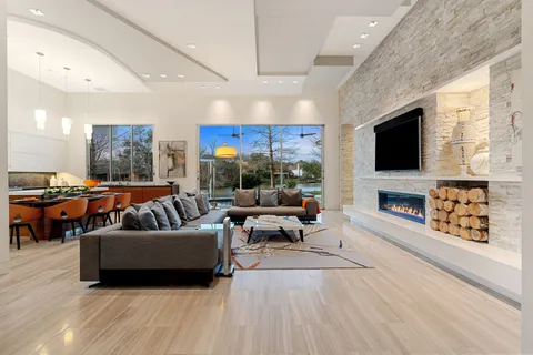 a living room with furniture and a flat screen tv