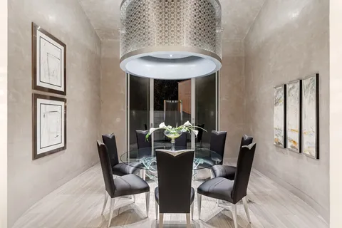 a room with furniture and a floor to ceiling window