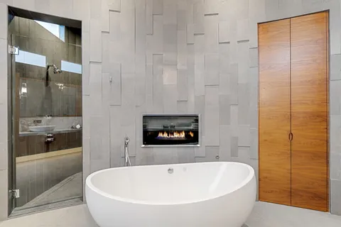 a view of a patio with a dining table and chairs with wooden floor