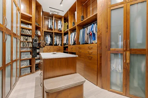 a kitchen with stainless steel appliances granite countertop a sink and a stove