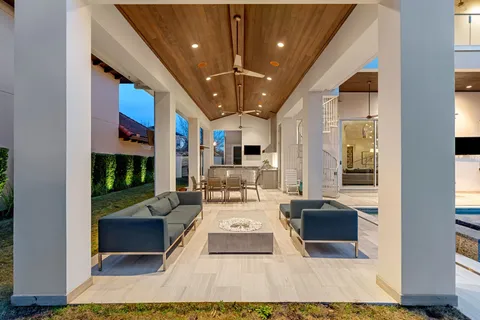 a swimming pool with outdoor seating and yard