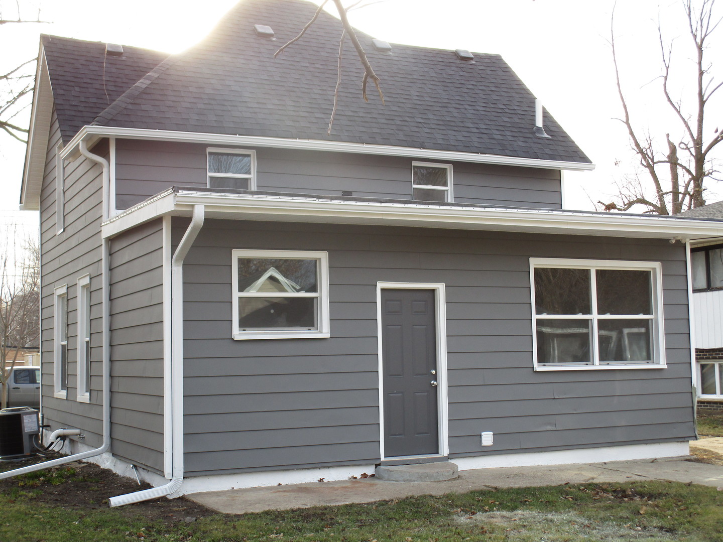403 West Washington Street Harvard, IL 60033 - Photo 3 of 13 a front view of a house with a yard
