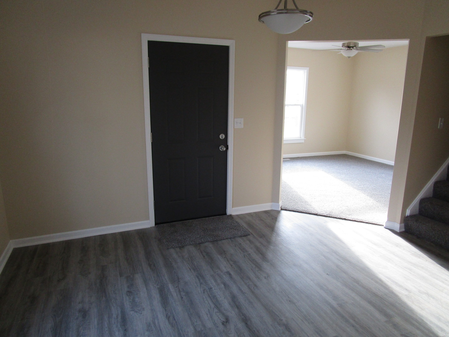 403 West Washington Street Harvard, IL 60033 - Photo 8 of 13 an empty room with wooden floor and windows