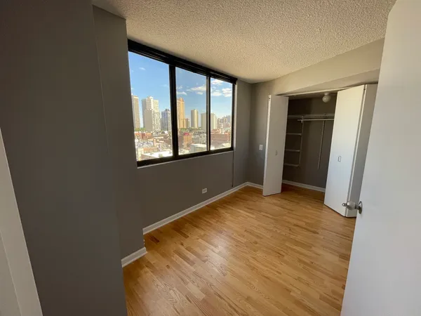 a view of an empty room with a window