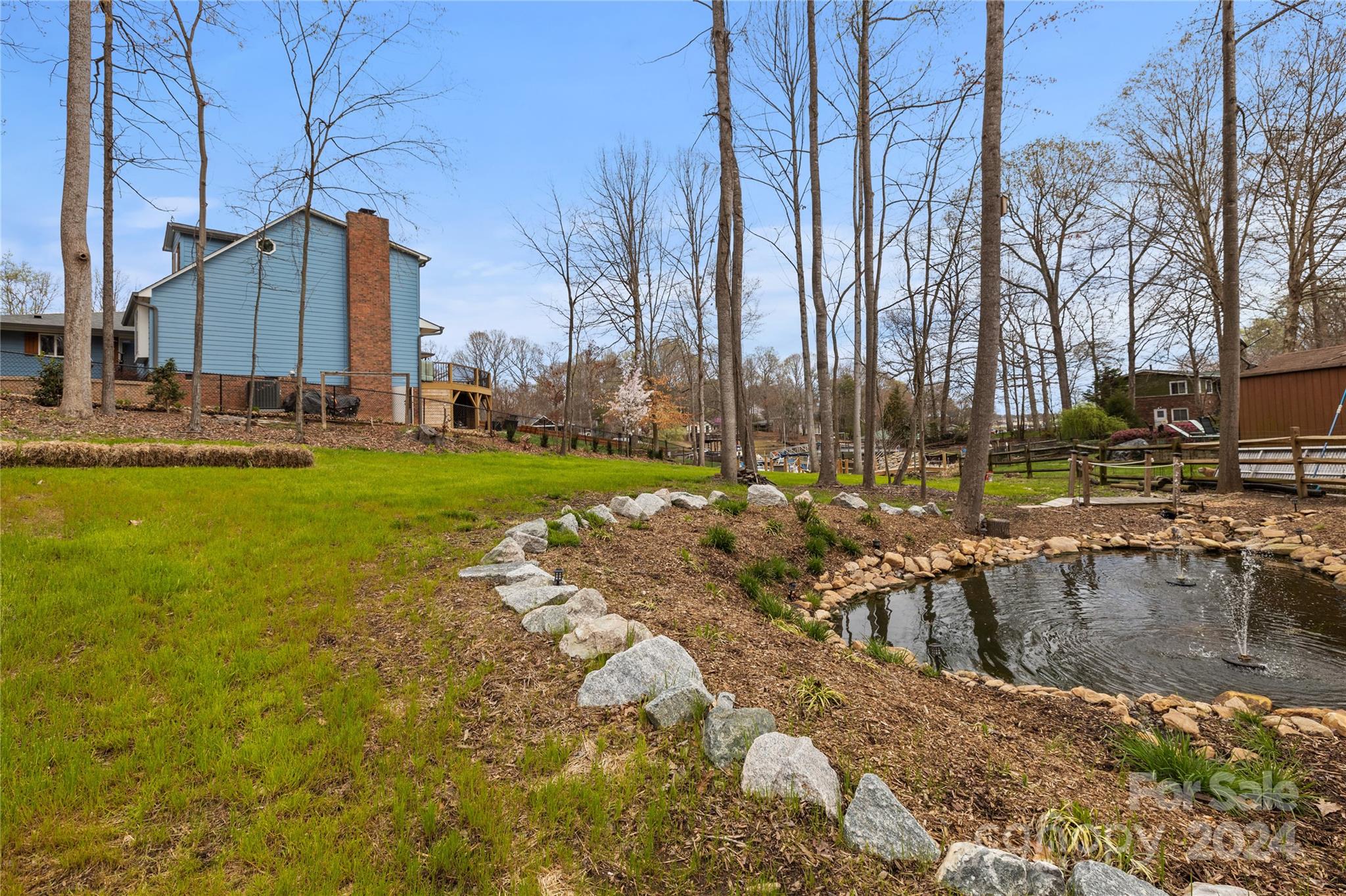 Lot 67 Lake Shore Road South Denver, NC 28037 - Photo 27 of 48 a view of a lake with a house