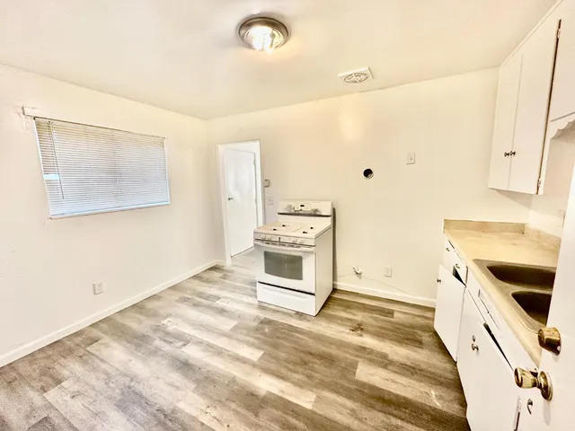 a kitchen with a stove and a microwave