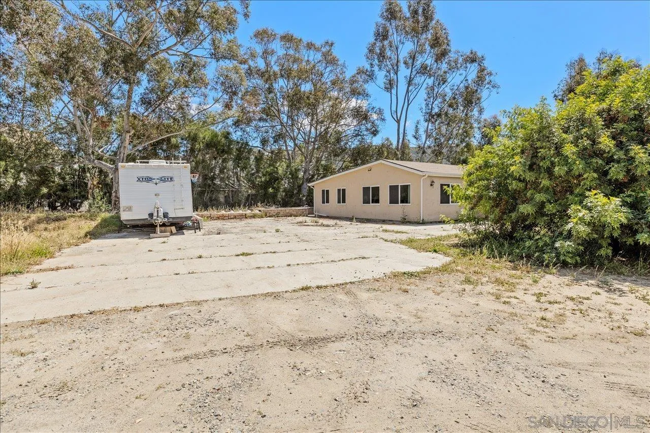 5461 Rainbow Creek Road, Unit THREE LEGAL LOTS Fallbrook, CA 92028 - Photo 28 of 28 a view of white house with a yard