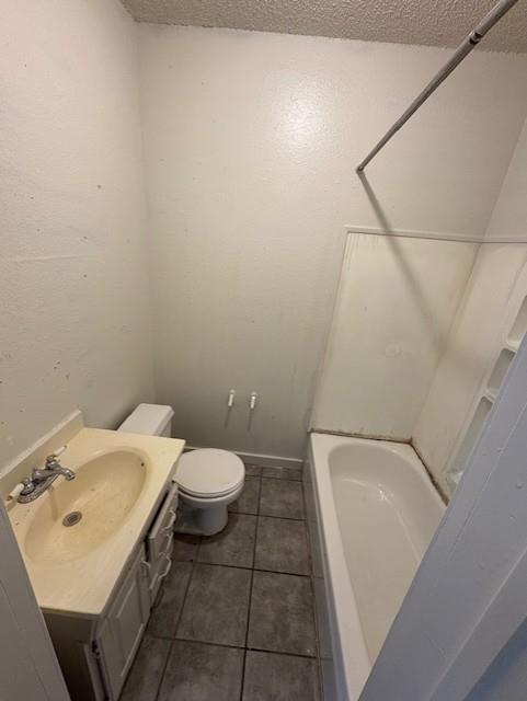 709 Grape Street, Unit D Abilene, TX 79601 - Photo 4 of 7 a bathroom with a sink and toilet