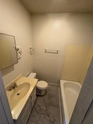 a bathroom with a sink and toilet
