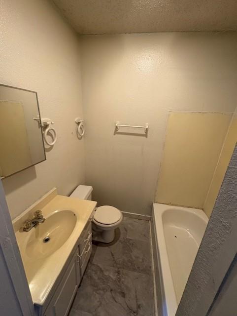 709 Grape Street, Unit D Abilene, TX 79601 - Photo 5 of 7 a bathroom with a sink and toilet