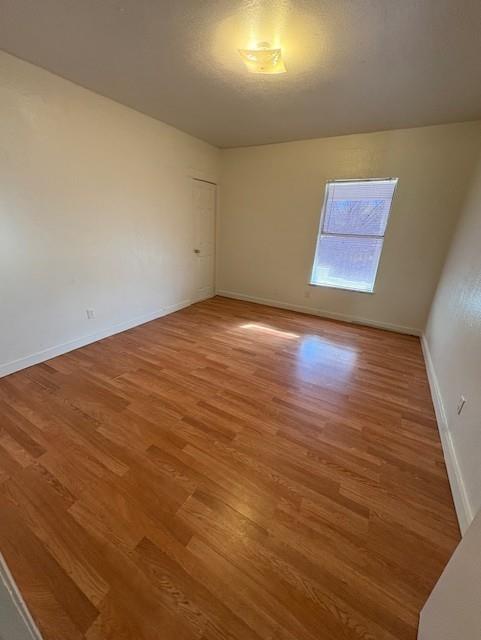 709 Grape Street, Unit D Abilene, TX 79601 - Photo 7 of 7 a view of an empty room with wooden floor